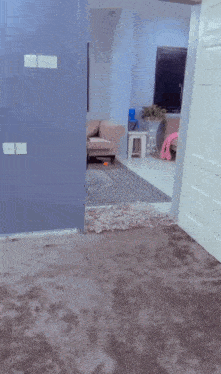 a little boy is walking through a doorway in a room