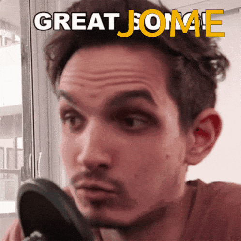 a man looking at his face in a mirror with the words great jome written above him