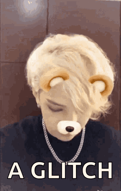 a person wearing a teddy bear face mask with the words a glitch below it
