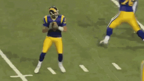 a football player with the number 96 on his jersey is being tackled