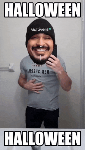 a man taking a picture of himself with the words halloween below him
