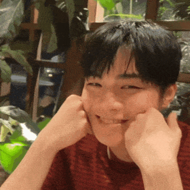 a young man making a face with his hands