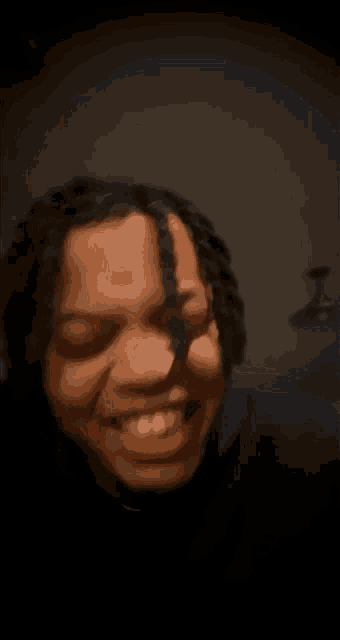 a close up of a person 's face with a blurry background