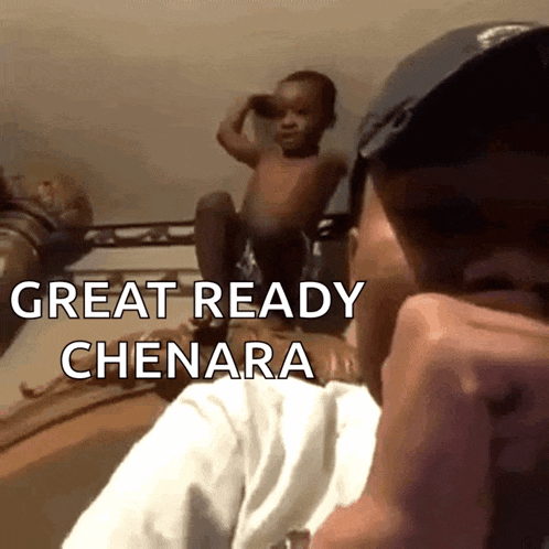 a man holding a baby with the words " great ready chenara " on the bottom