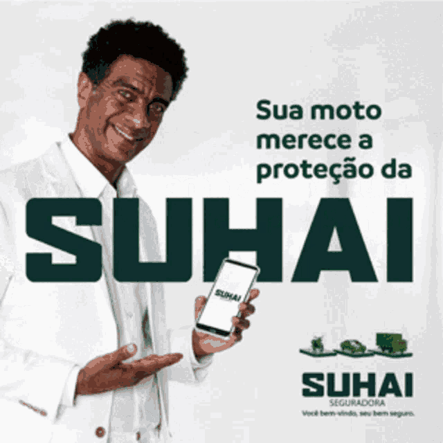 a man in a white suit is holding a phone with suhai on it