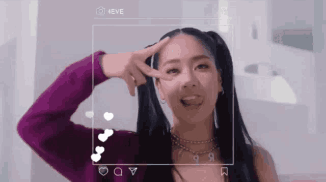 a woman is making a peace sign in front of a camera that says 4eve on it
