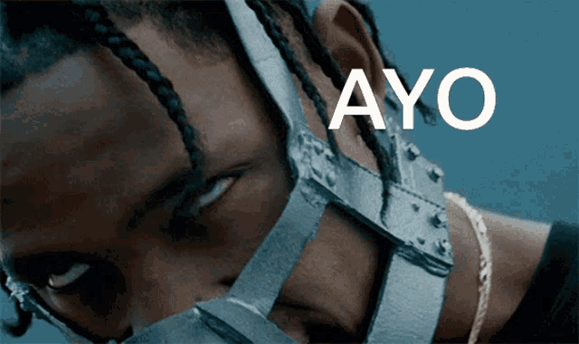 a close up of a person 's face with the word ayo written on it