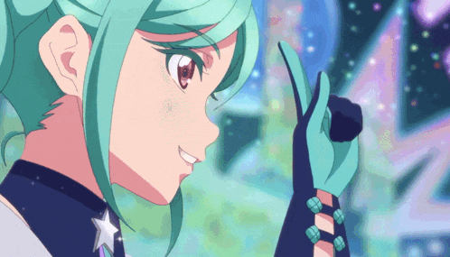 a girl with green hair holds a microphone in her hand