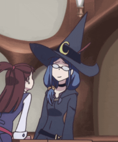 a witch with a c on her hat is talking to another witch