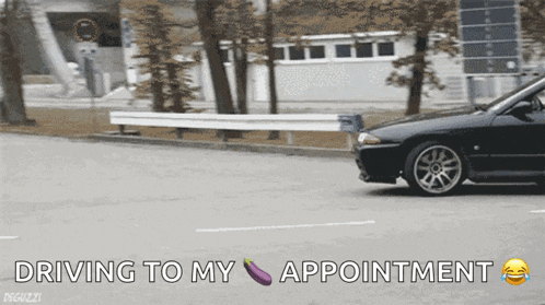 a black car is driving down a street with the words " driving to my appointment " below it