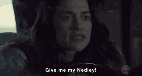 a woman is driving a car and saying give me my nedley