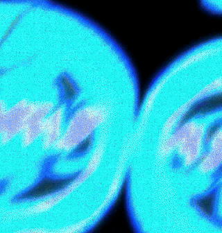 a close up of two blue circles on a black background that looks like a smiley face