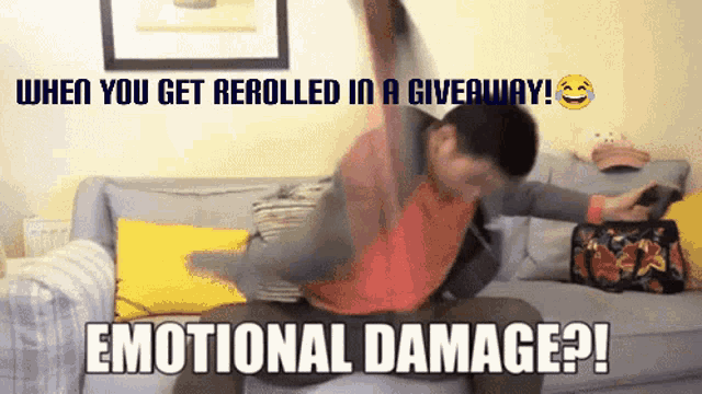 a man sitting on a couch with a caption that says emotional damage