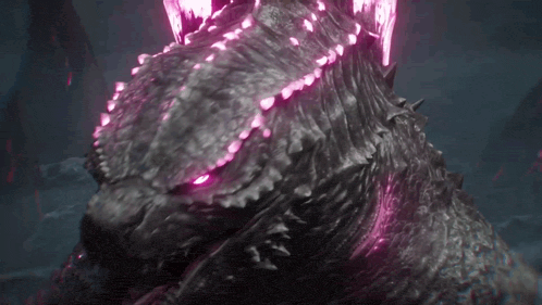 a close up of a monster with pink lights coming out of its eyes