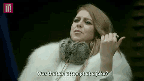 a woman in a white fur coat is talking on a cell phone .