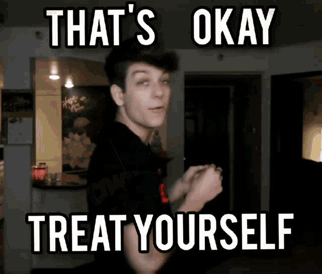 a man is standing in front of a sign that says that 's okay treat yourself .