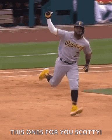 a baseball player for the pittsburgh pirates is running towards home plate .