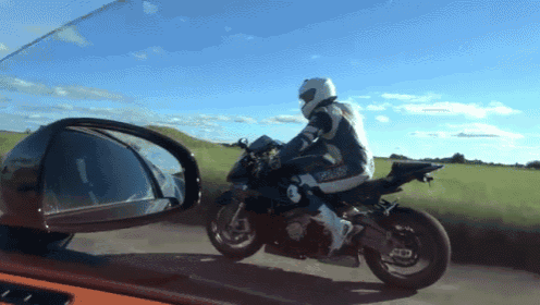 a person riding a motorcycle with a license plate that says ' sds ' on it