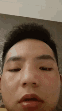 a close up of a man 's face with his eyes open