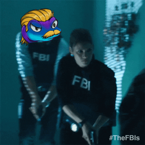 a man in a fbi uniform holds a gun in a dark room