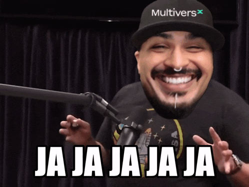 a man wearing a hat that says multivers is smiling
