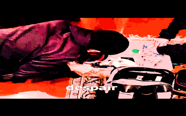 a person kneeling on the floor with despair written on the bottom right