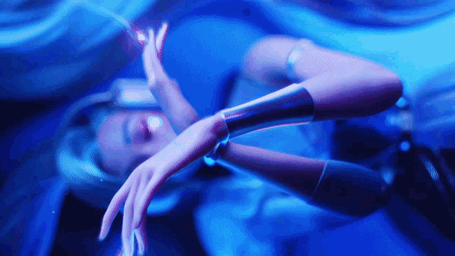 a woman is laying down with her arms outstretched