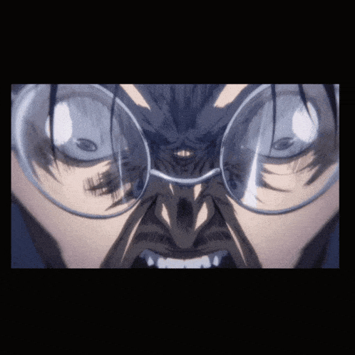 a close up of a person 's face with glasses