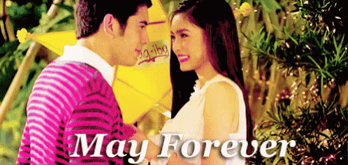 a man and a woman are looking at each other with the words may forever on the bottom