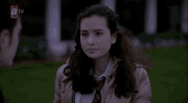 a tv screen shows a girl talking to a man