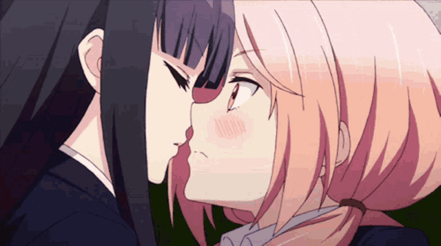 a couple of anime girls kissing each other on the cheek
