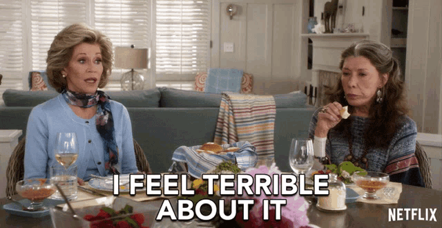 two women sitting at a table with netflix written on the bottom right