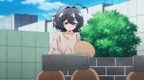 a girl with a sad look on her face stands in front of a wall