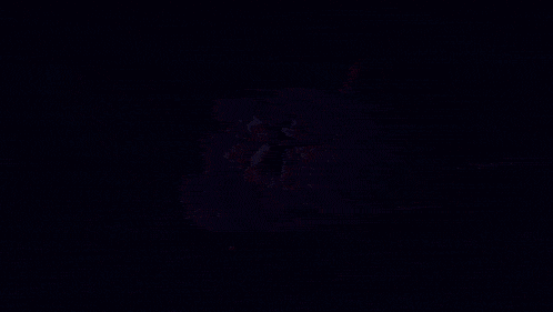 a close up of a person 's face with purple lights behind them