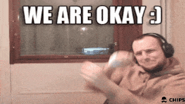 a man wearing headphones with the words we are okay behind him