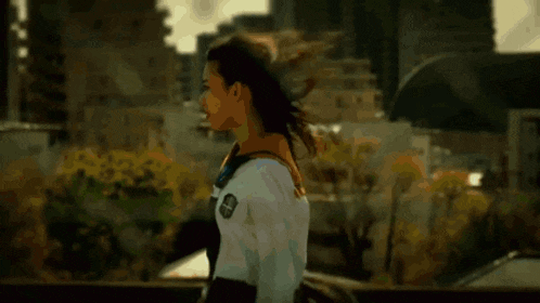 a blurry picture of a woman holding a bottle
