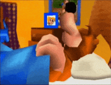 a cartoon character is laying on a bed with a picture of a dog on the television