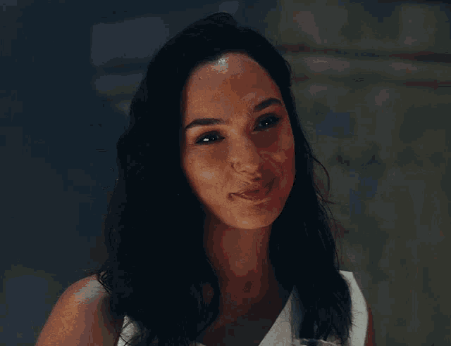 a close up of a woman 's face with a smile on her face