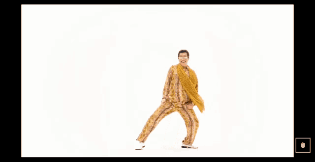 a man wearing glasses and a leopard print scarf is dancing .