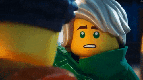a close up of a lego figure with a surprised face .
