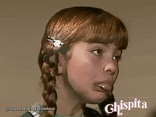 a girl with red hair is smiling with the word chispita on the bottom right
