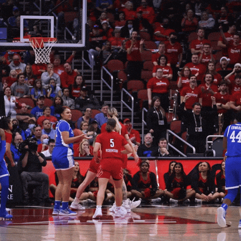 a basketball game is being played in front of a crowd with a player wearing number 44