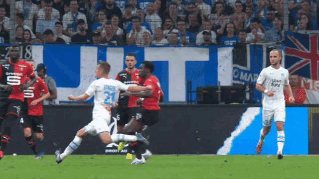a soccer player wearing a jersey that says uber eats on it