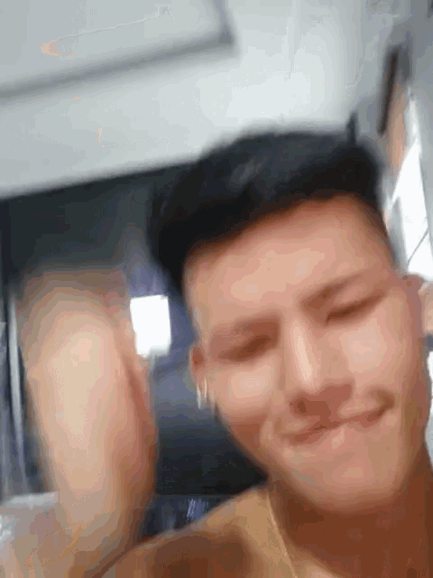 a man without a shirt is smiling and making a face