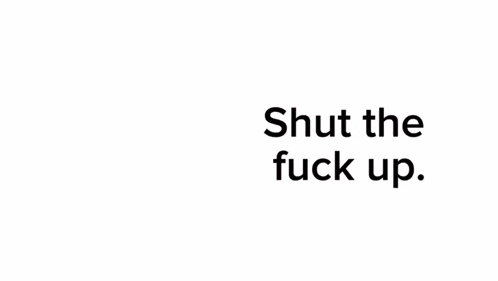 a woman in a pink dress is holding a microphone with the words shut the fuck up behind her