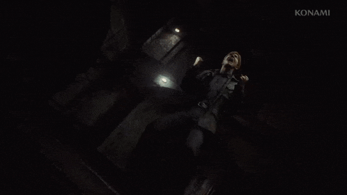 a man is screaming in a dark room in a video game while holding a flashlight .