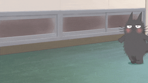 a black cat is standing on a green floor in front of a wall