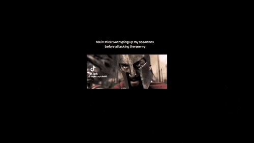 a man is holding a shield and a knife in a video .