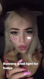 a woman is running a red light for fudge on her face .