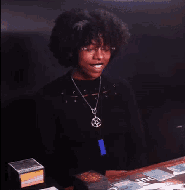 a woman sitting at a table with the words it 's the best on the bottom